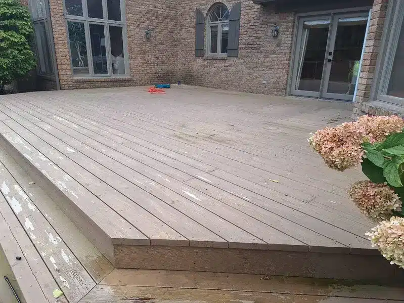 Weathered wood deck with peeling stain before sealing by Seal Now
