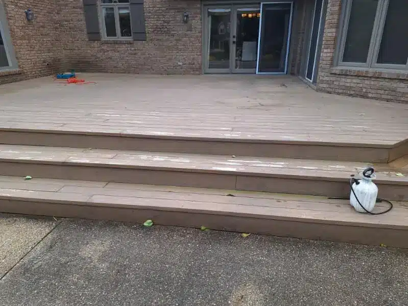 Pressure washing deck steps before applying wood sealant